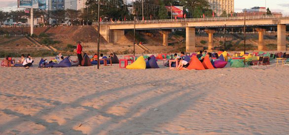 Strangely beautiful 'beach' on the riverbank, people enjoy checking in